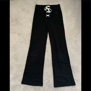 Black flared sweatpants with lace up detail